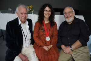 Leon Rooke, Peter Halasz, and a peculiar woman with a fabulous medal. Photo by Peter Grimaldi